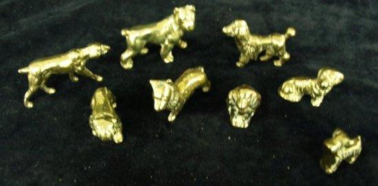 Appraisal: A group of eight brass dogs various breeds