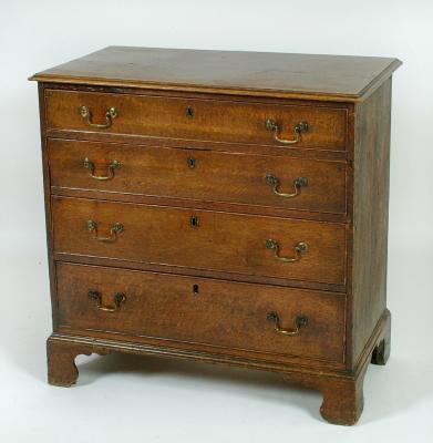 Appraisal: A GEORGE III OAK CHEST of four graduated cockbeaded drawers