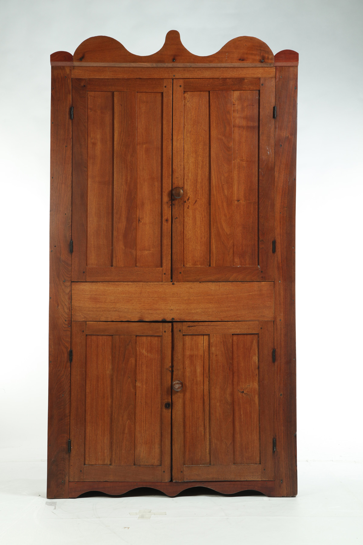 Appraisal: ONE-PIECE BLIND-DOOR CORNER CUPBOARD American rd quarter- th century Walnut