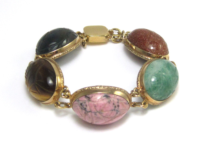 Appraisal: SCARAB STONE BRACELET having five large semi-precious oval cabochon stones