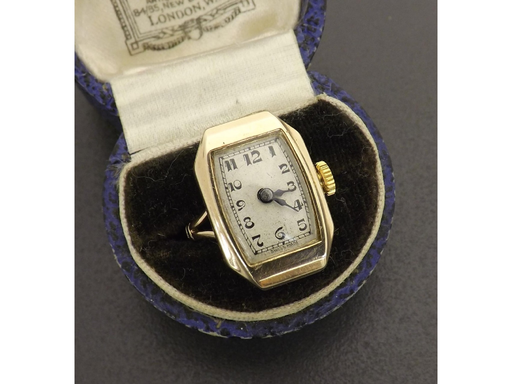 Appraisal: Novelty ct ring watch the rectangular silvered dial with Arabic