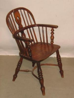 Appraisal: AN ASH AND ELM WINDSOR ARMCHAIR of low hooped back