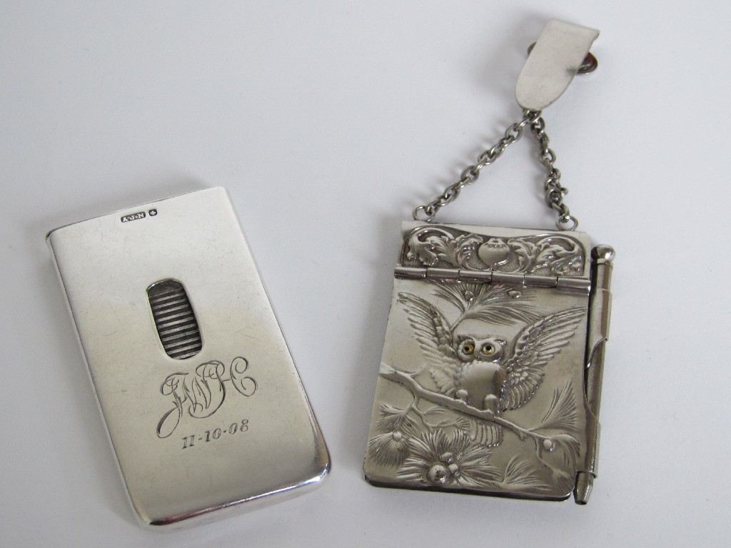 Appraisal: A white metal card case with flip top action maker's