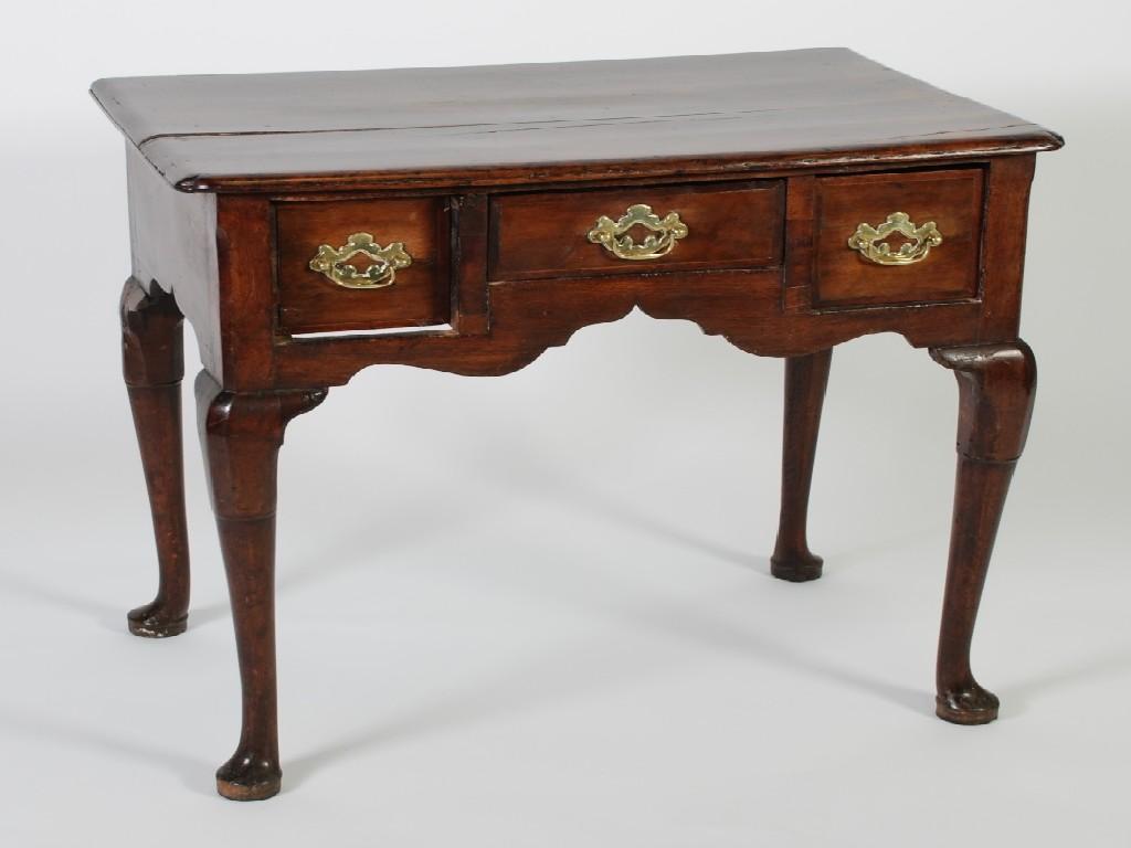 Appraisal: EIGHTEENTH CENTURY COUNTRY MADE WALNUTWOOD LOWBOY the top with re-entrant