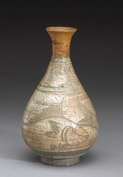 Appraisal: A punch'ong-decorated stoneware bottle Joseon Dynasty th th Century Of