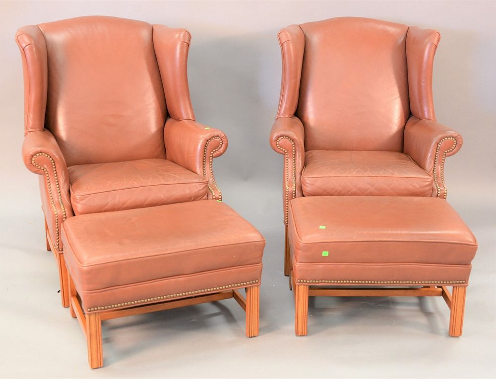 Appraisal: Pair of Ethan Allen leather wing chairs and ottomans warned