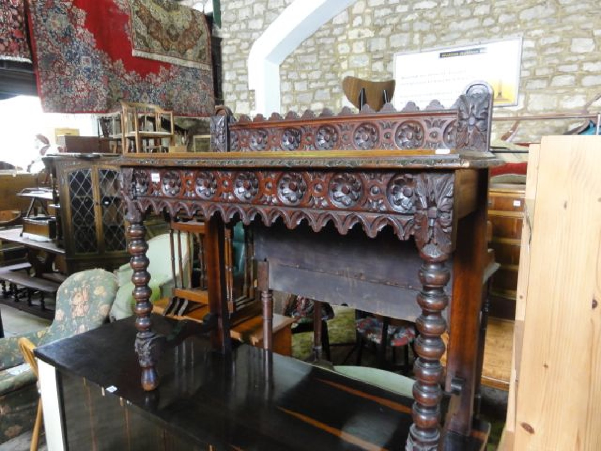 Appraisal: A Victorian oak side hall table with carved foliate detail