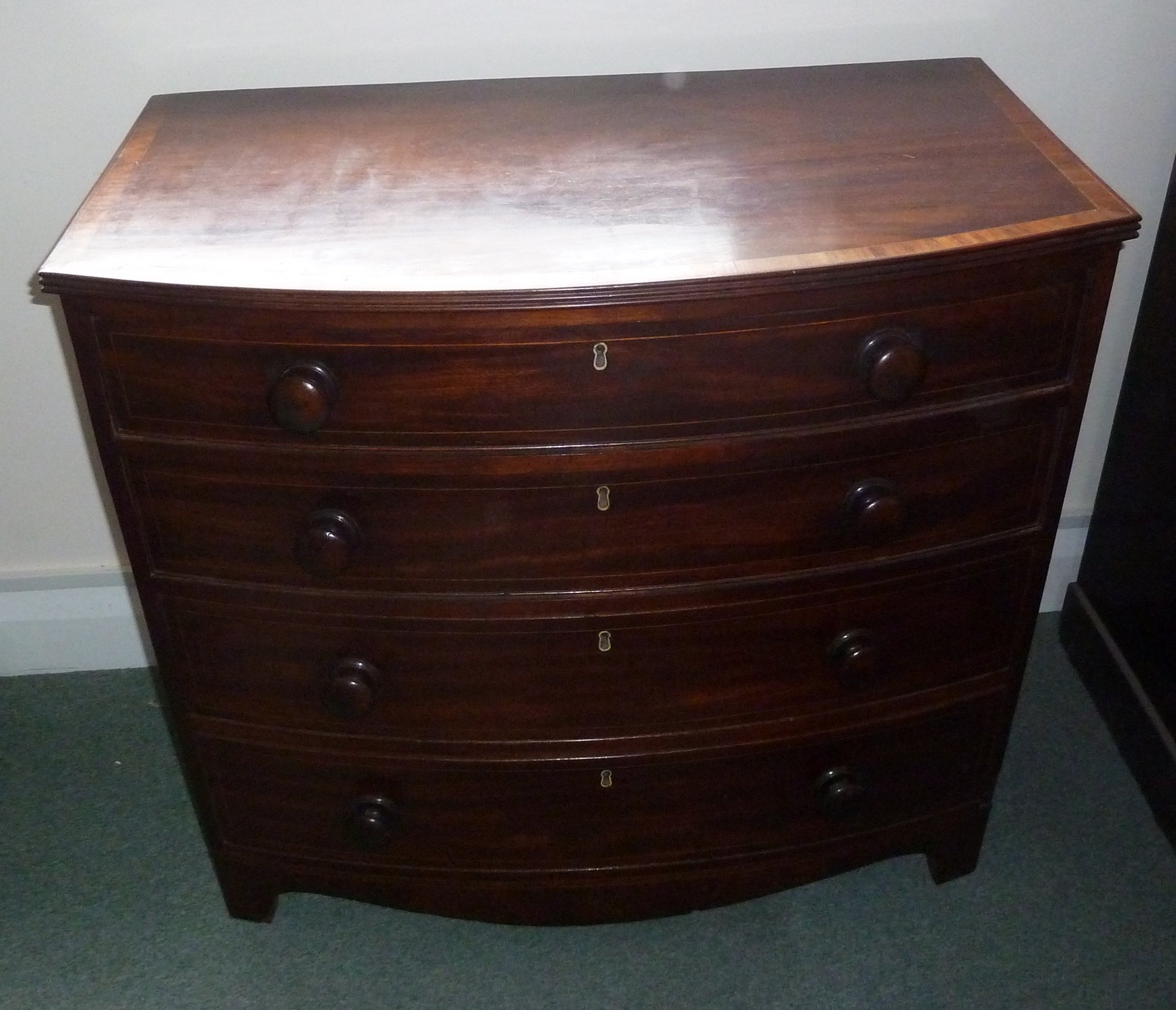 Appraisal: A Regency mahogany bowfront chest the top with moulded border