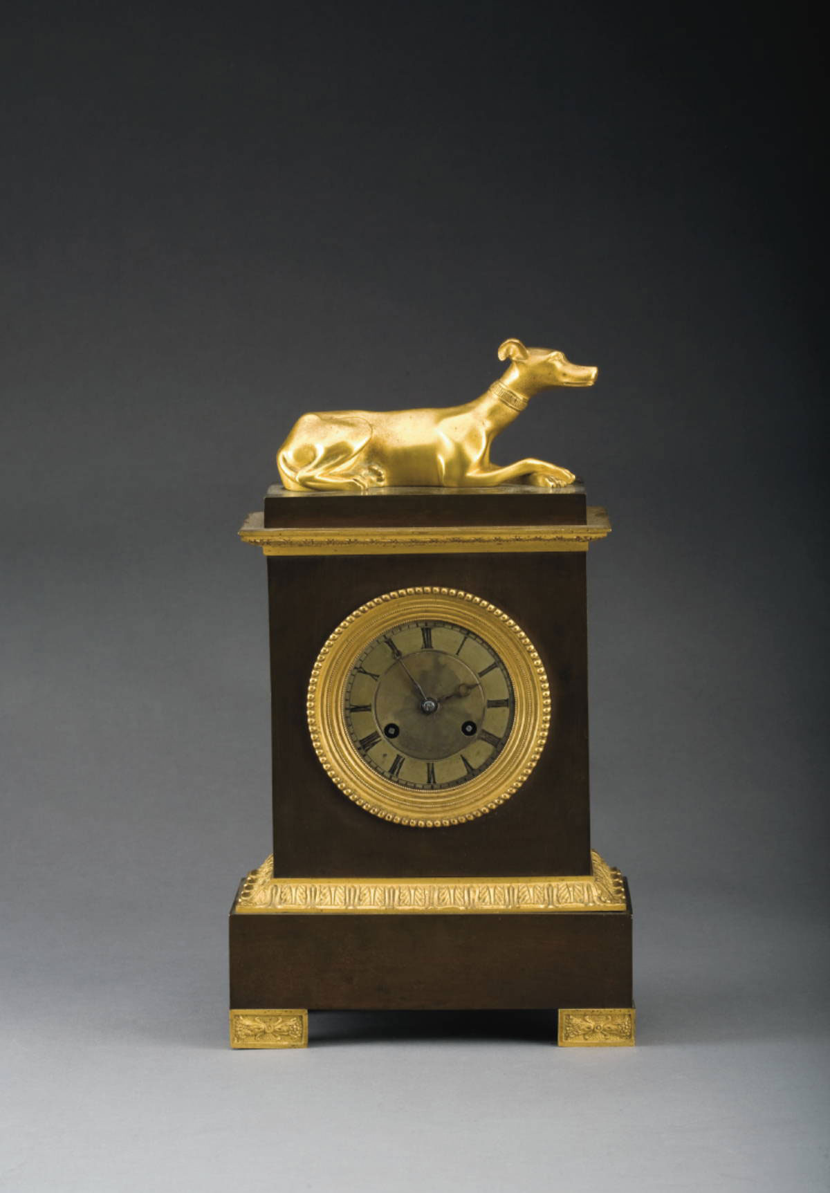 Appraisal: FRENCH PATINATED AND GILT-METAL MANTEL CLOCK The rectangular case surmounted