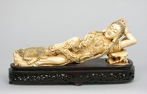 Appraisal: Ivory Carving of a Reclining Woman This carving features a