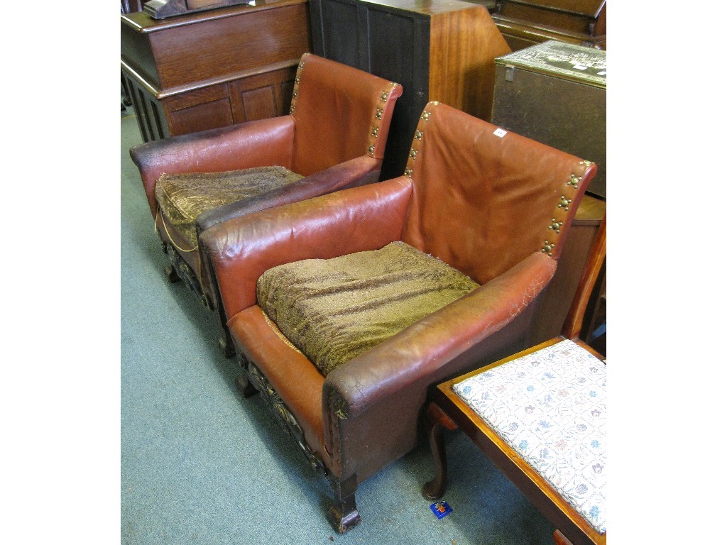 Appraisal: Pair of oak framed leather upholstered easy chairs