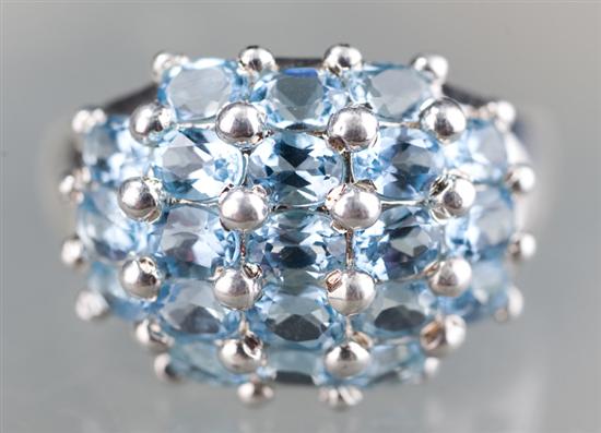 Appraisal: Sterling silver dome ring with blue topaz stones Ring contains