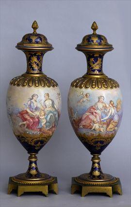 Appraisal: PAIR OF LOUIS XVI-STYLE GILT-METAL-MOUNTED SEVRES PORCELAIN VASES AND COVERS