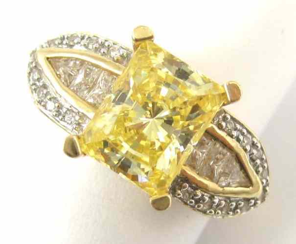 Appraisal: FOURTEEN KARAT YELLOW AND WHITE GOLD RING with round-cut and