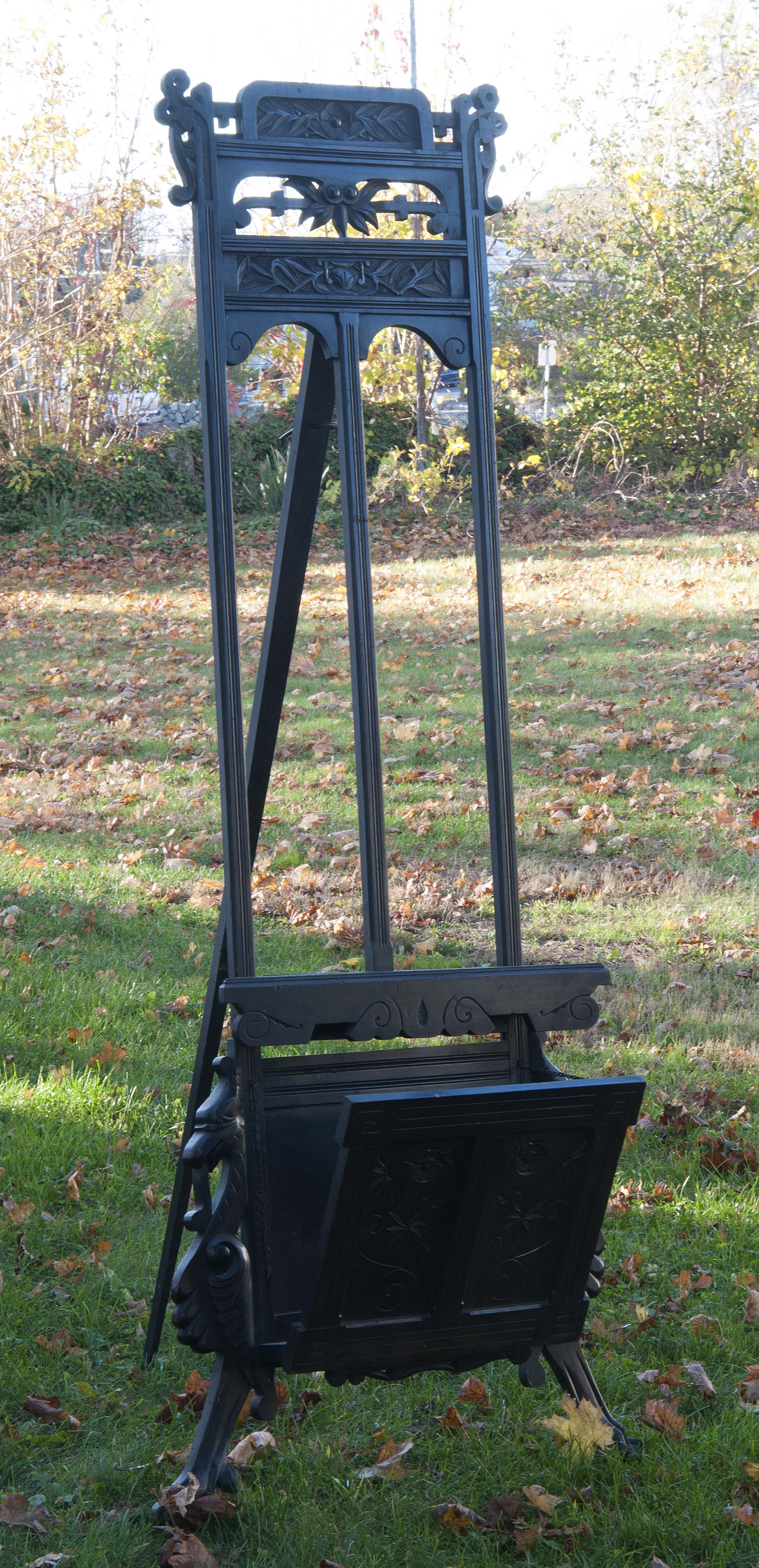 Appraisal: EBONIZED CARVED WOODEN EASEL With Eastlake flower and urn design