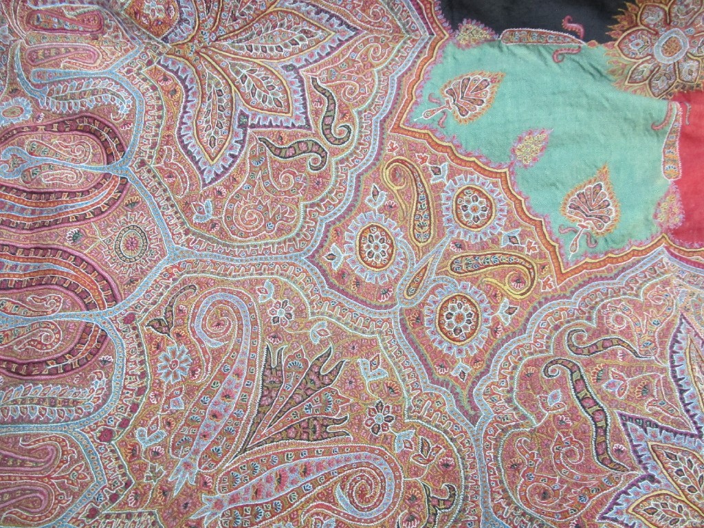 Appraisal: An Indian Embroidered shawl with radiating pattern surrounding a central