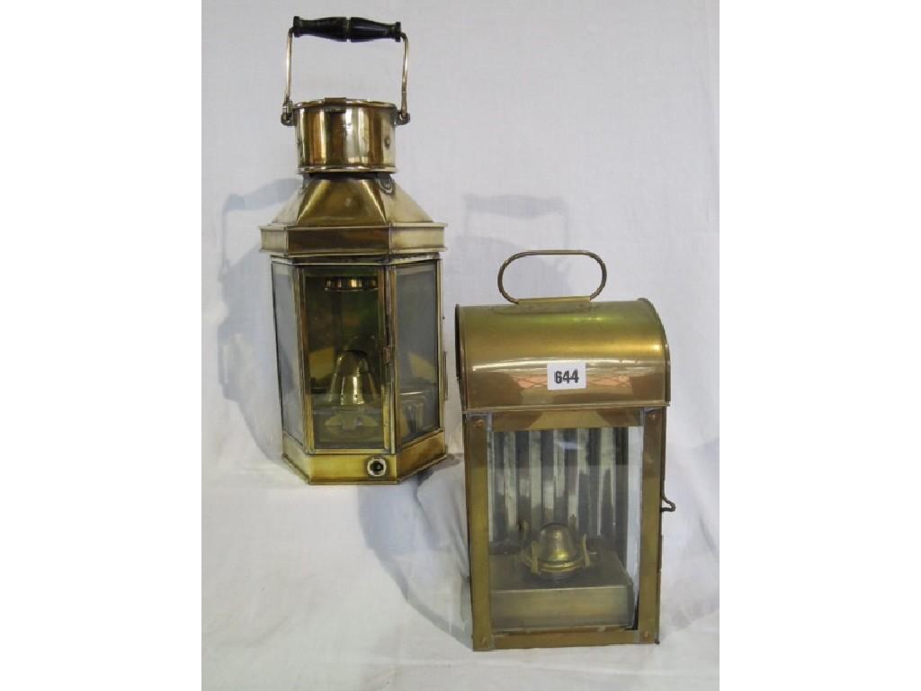 Appraisal: A pair of brass th century galley lamps with glass