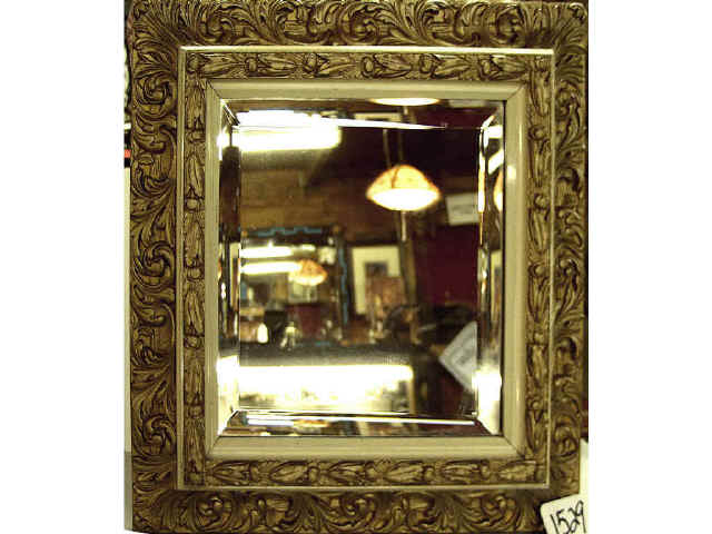 Appraisal: Double beveled mirror in fancy carved frame x Estimate -