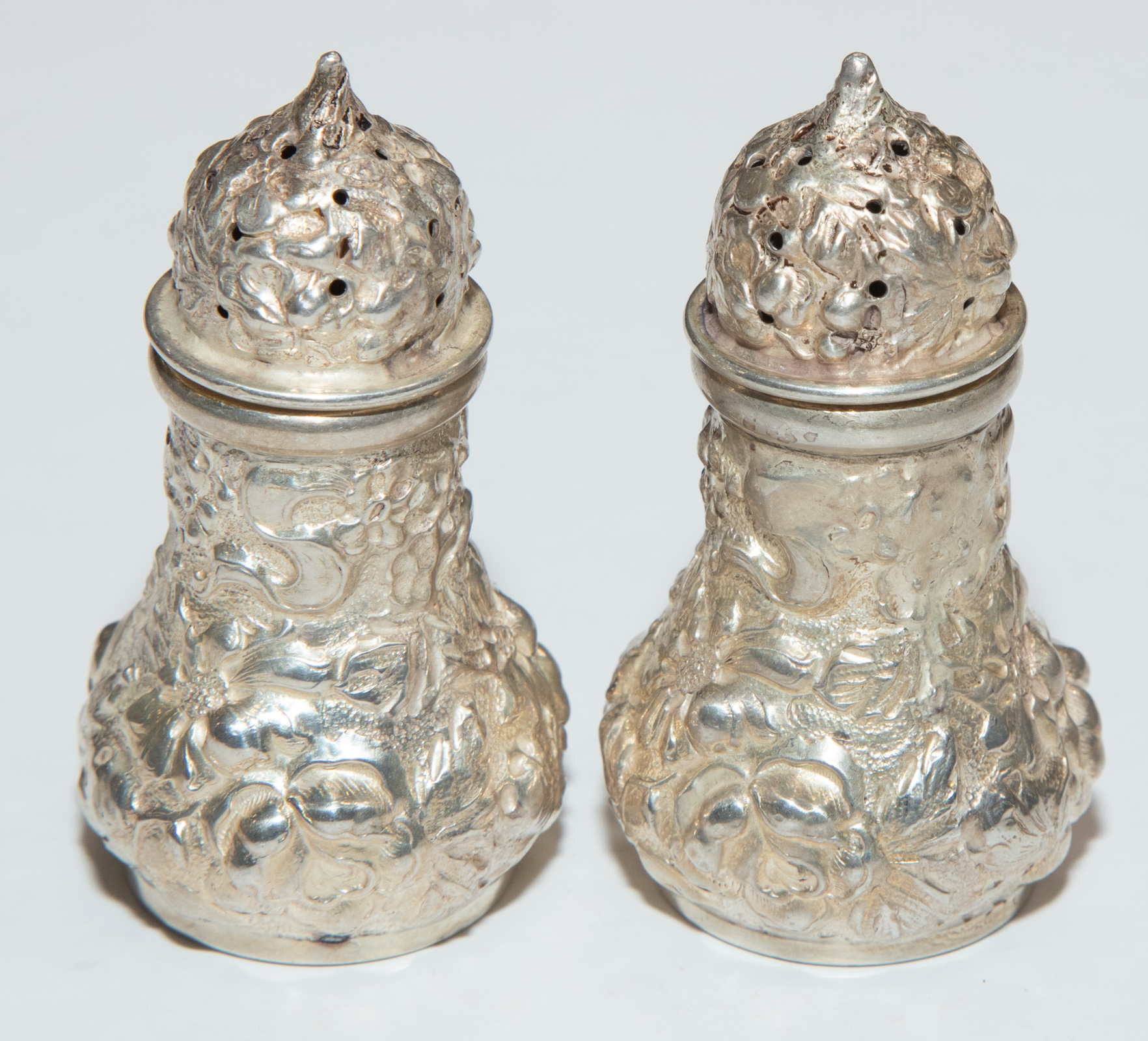 Appraisal: STIEFF STERLING REPOUSSE SALT PEPPER SHAKERS Circa model in H