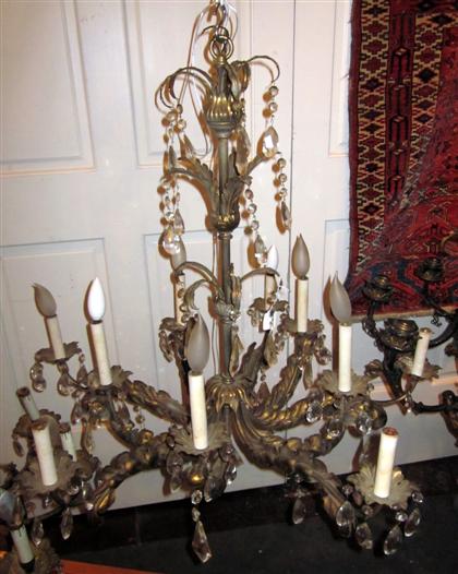 Appraisal: Continental gilt metal and glass chandelierThe foliate cast frame issuing