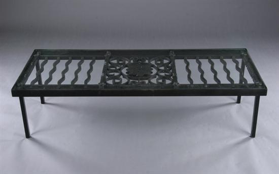 Appraisal: MODERN WROUGHT-IRON LOW TABLE th century Inset rectangular glass top