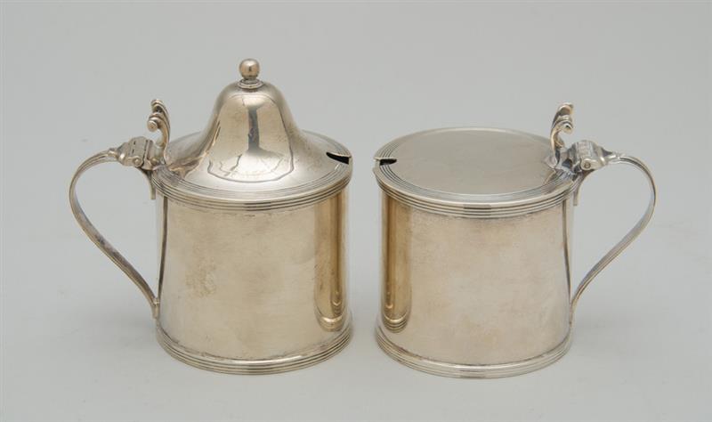 Appraisal: TWO SIMILAR ENGLISH SILVER MUSTARD POTS WITH BLUE GLASS LINERS