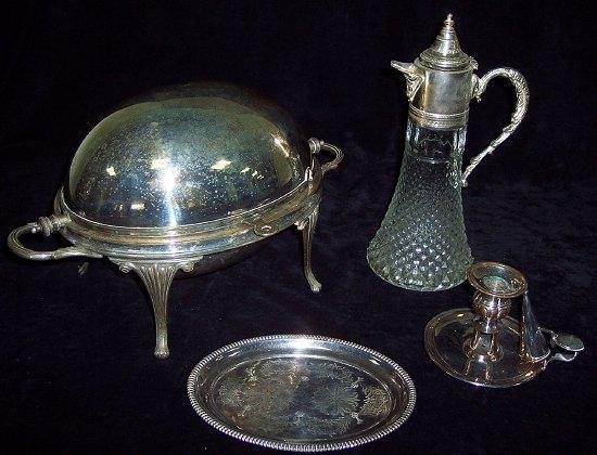 Appraisal: A Sheffield plate chamber candlestick a waiter a breakfast heater