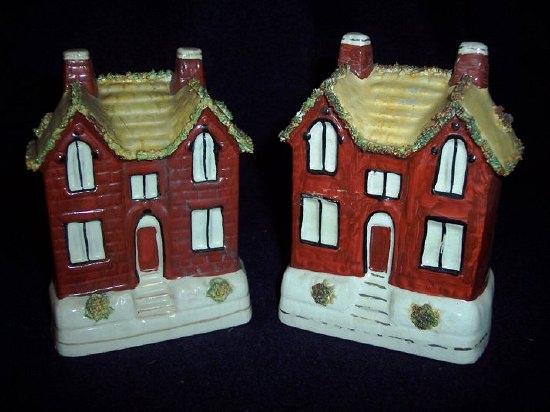 Appraisal: A complementary pair of Staffordshire red brick cottage money boxes