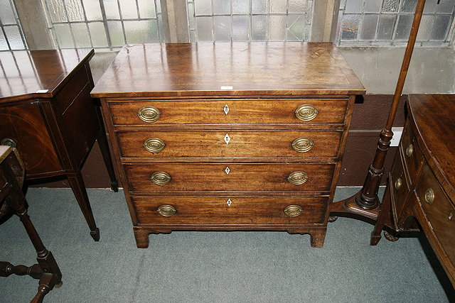 Appraisal: A TH CENTURY MAHOGANY STRAIGHT FRONT CHEST OF FOUR GRADUATED