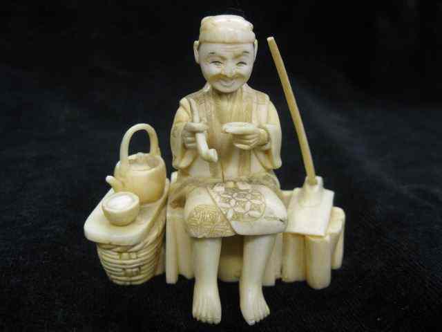 Appraisal: Carved Ivory Figurine seated man at rest teapot by his