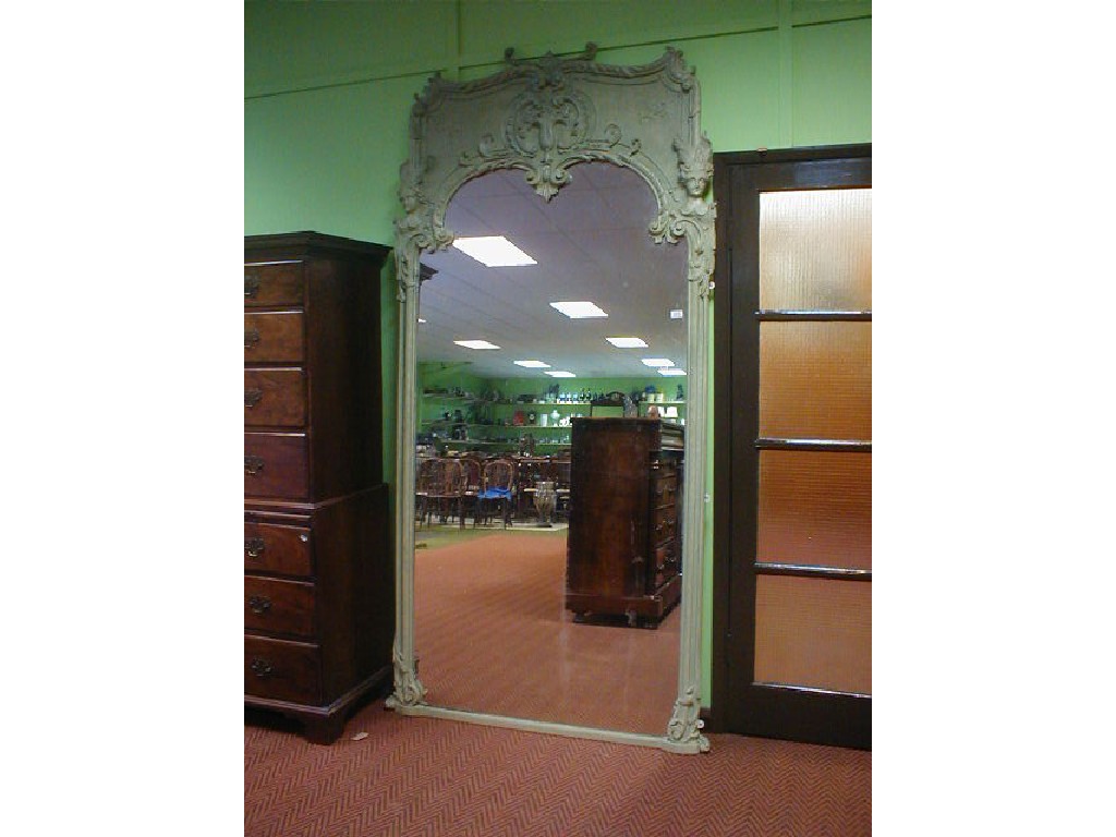 Appraisal: A thC plaster framed wall mirror of rococo shape and