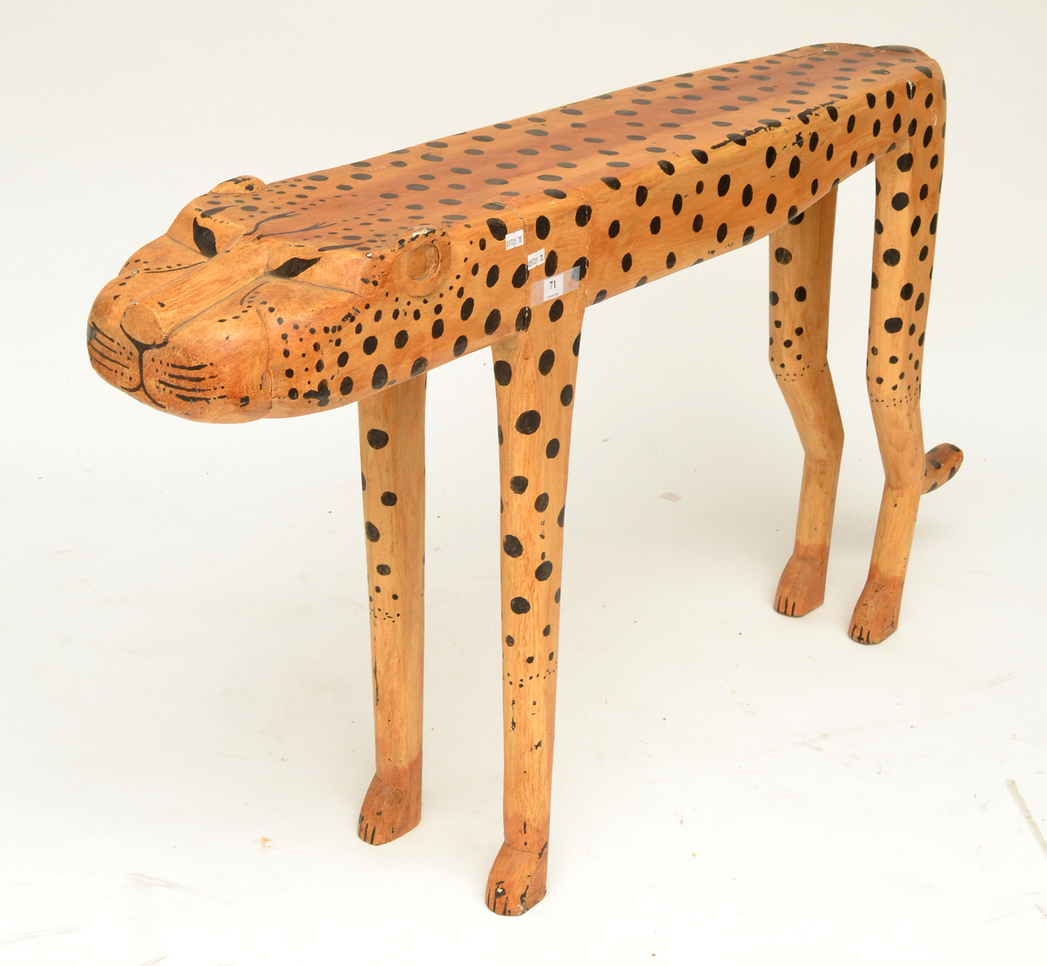 Appraisal: A NAIVE PAINTED WOODEN FLOOR STANDING MODEL OF A LEOPARD