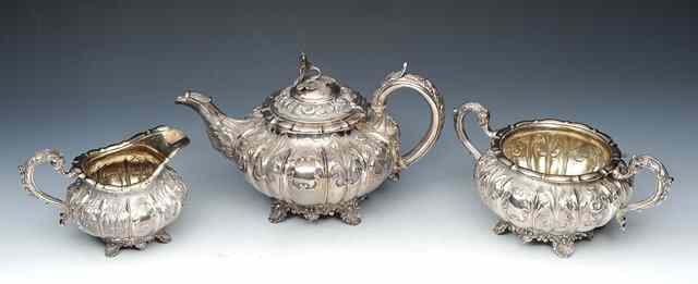 Appraisal: A WILLIAM IV SILVER THREE PIECE TEA SERVICE of compressed