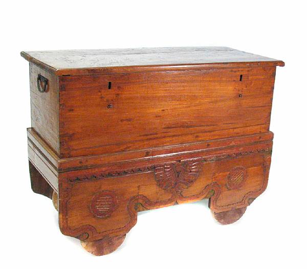 Appraisal: A Continental mixed wood dough bin on a carved plinth