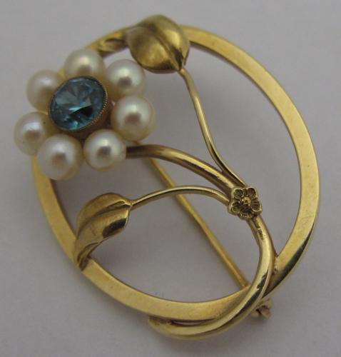 Appraisal: ZIRCON PEARL AND K GOLD FLORAL BROOCH oval in shape