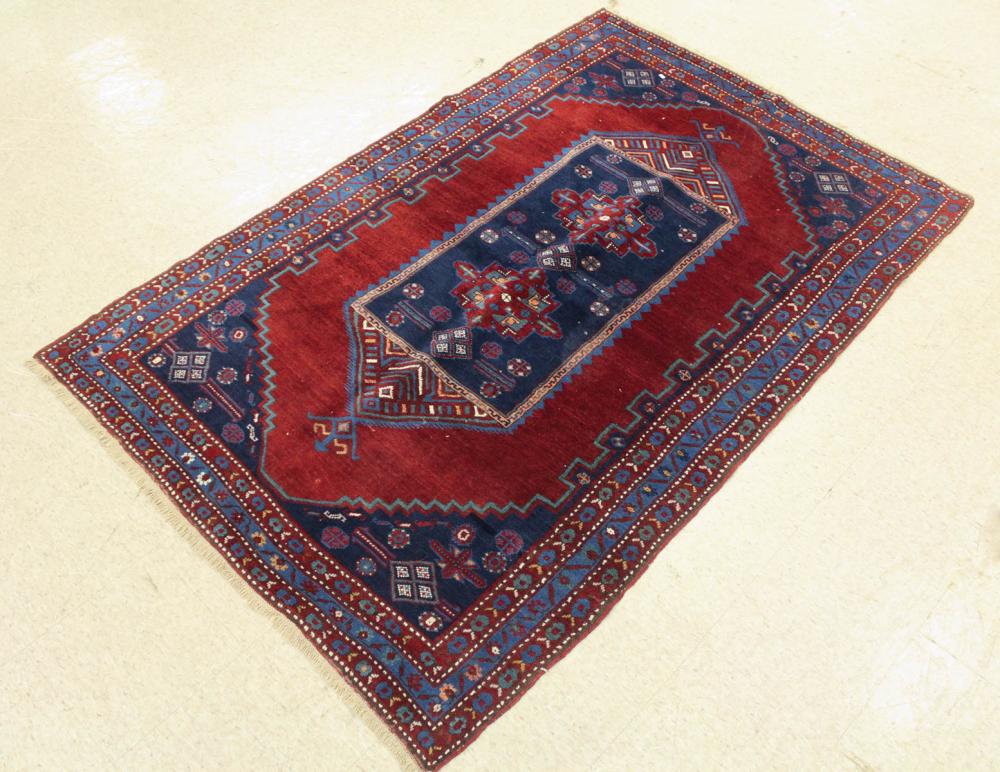 Appraisal: PERSIAN BELOUCHI TRIBAL AREA RUG central panel medallion design on