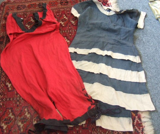 Appraisal: Two bathing costumes circa one of navy blue knit with