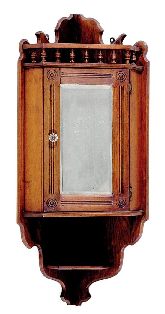 Appraisal: Eastlake Victorian walnut hanging corner cabinet late th century spindled