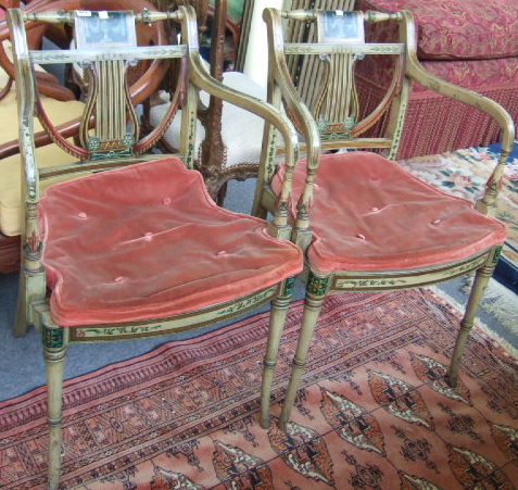 Appraisal: A pair of Sheraton style painted open armchairs early th