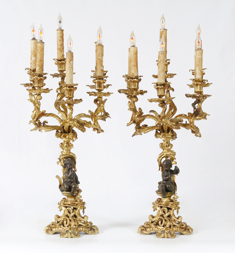 Appraisal: PAIR ROCOCO STYLE GILT BRONZE FIGURAL CANDELABRA Electrified light heavy