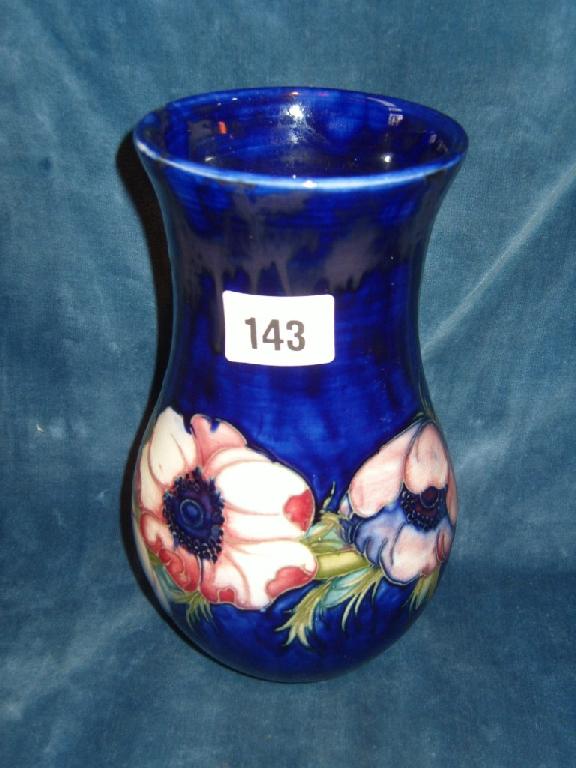 Appraisal: A Moorcroft blue ground vase with painted pink and mauve