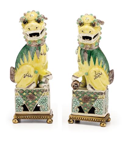 Appraisal: Pair of Chinese gilt bronze mounted Fu lions th th