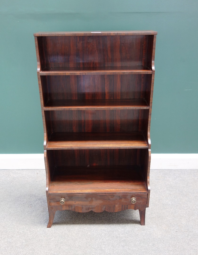 Appraisal: A late th century rosewood five tier waterfall bookcase with