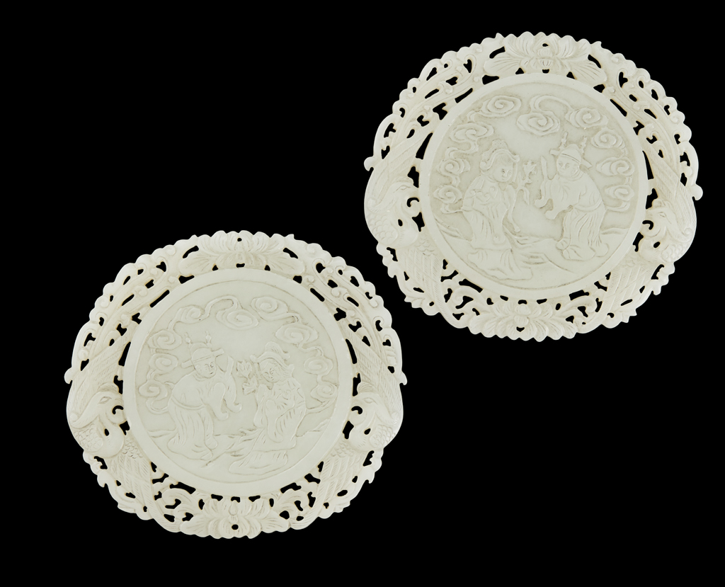 Appraisal: PAIR OF PALE CELADON JADE WEDDING PLAQUES of circular shape