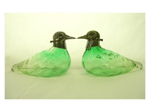 Appraisal: Pair of green art glass duck motif decanters with silver