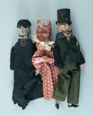 Appraisal: Three carved painted wooden puppets pig with finger holes others