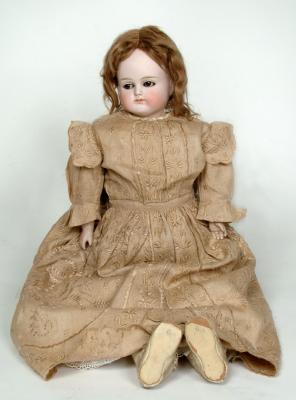 Appraisal: A German bisque shoulder head girl doll with off set