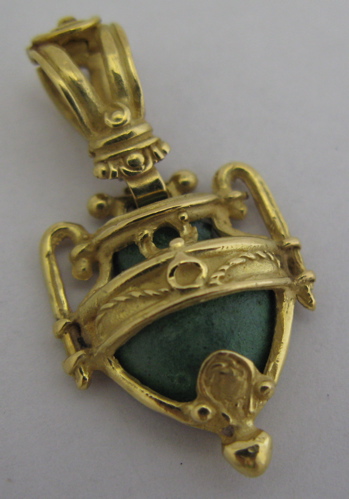 Appraisal: PATINATED BRONZE AND K YELLOW GOLD PENDANT - in length