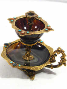 Appraisal: An ormolu mounted agate chamberstick decorated with turquoise and hardstone