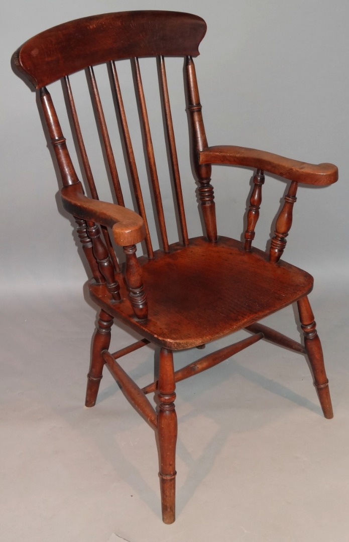 Appraisal: A thC ash and elm grandfather chair with a overhanging